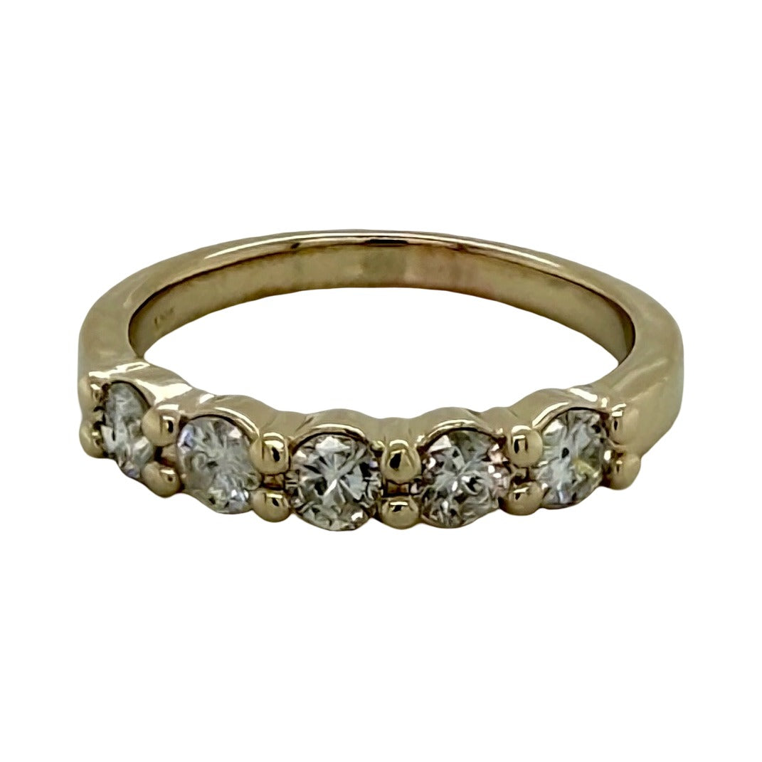 14K yellow gold five-stone anniversary band, five round diamonds set in shared prongs across the top of a polished tapered band