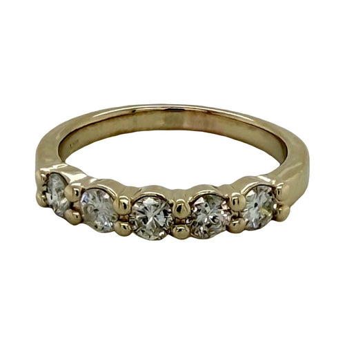 Load image 1 in gallery view. 14K yellow gold five-stone anniversary band, five round diamonds set in shared prongs across the top of a polished tapered band